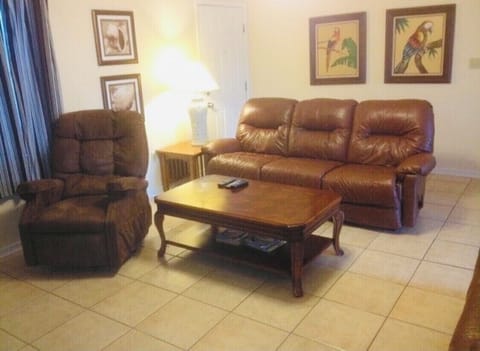 Leather couch and seating featuring 47”HD TV.