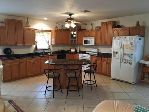 Fully Equipped Kitchen
Granite Counter-tops
Open floor plan
Island seating for 3