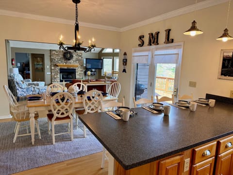 View into the main level dining area and family room from the kitchen.