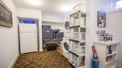 Laundry room with additional refrigerator. 