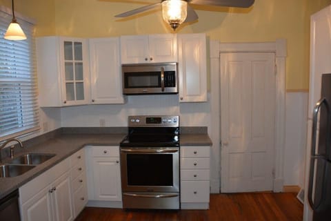 Lower unit kitchen provides comfortable space to prepare family meals.