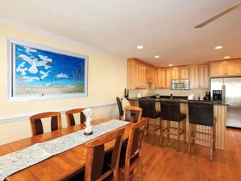 Replaced with New white table and 6 chairs (see next photo).