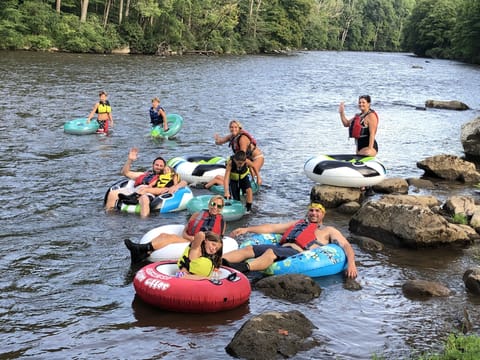 Walk up the river trail and tube down to the lodge