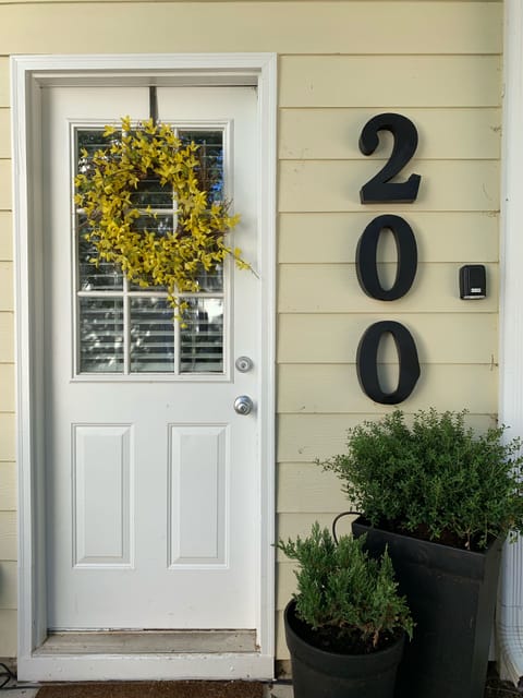 Back door with lock box. Just steps away from our other 2 units, #300 and #301 