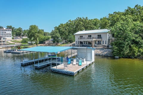 "Lakefront home with private dock, scenic views, and ample outdoor seating."