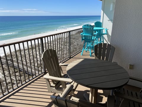 Top floor balcony, swivels and bistro, pelicans above and sounds of surf below