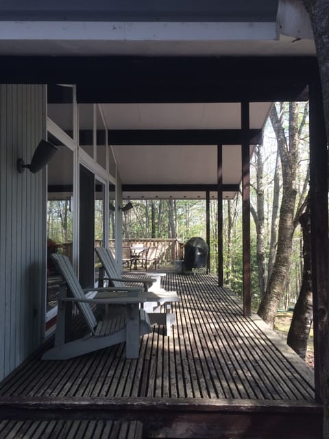Front deck with a peaceful view of the woods.