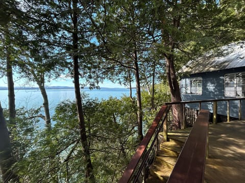 View of lake, great room, and deck.