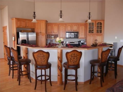 Gourmet kitchen, new 5 eye stove; 2 microwaves, high top seating for 6