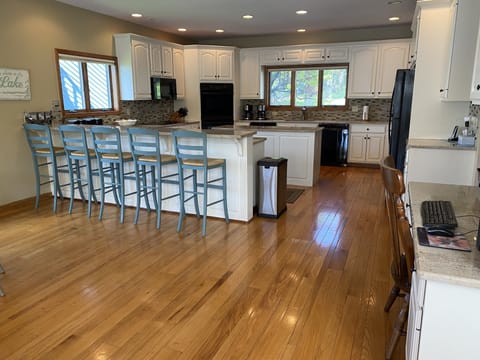 Fully stocked kitchen with 2 refrigerators, 2 ovens and 2 dishwashers 