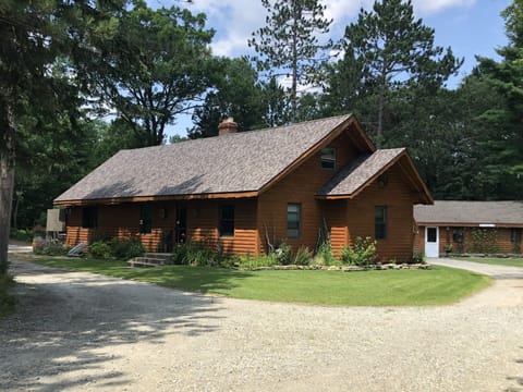 Log home with circular driveway