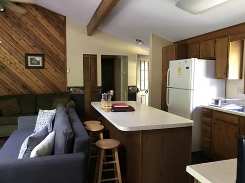 A galley kitchen is stocked with cooking and baking supplies