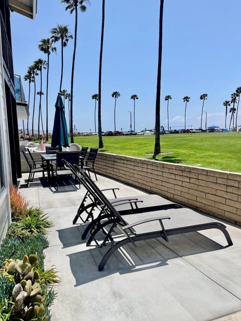 large patio,on boardwalk with grass
