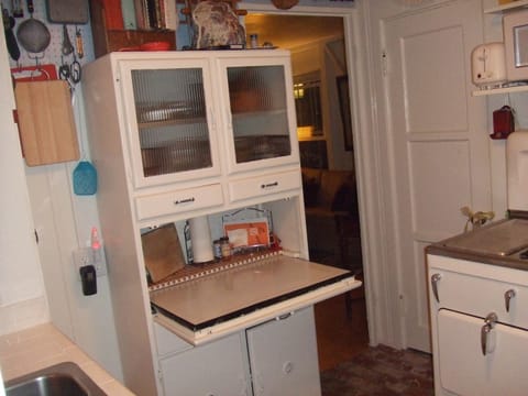 Vintage hoosier for extra counter space in Kitchen.