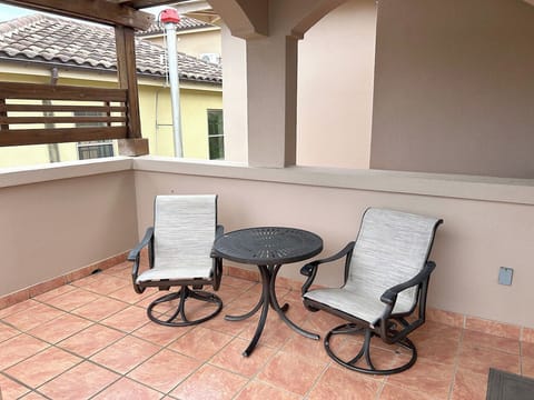 Off to the right of the living room, there is a side deck with a pergola for shade.  Imagine sitting here with an evening beverage watching the sunset