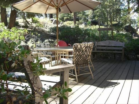 spacious back yard deck for entertaining and access to the community property