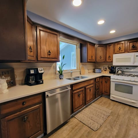 The kitchen is stocked and the dining table can seat another 8.