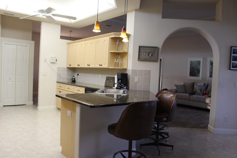 Kitchen area which overlooks the pool and lanai.