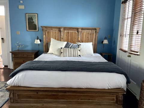 Spacious and serene bedroom featuring a king-sized bed with luxurious linens.