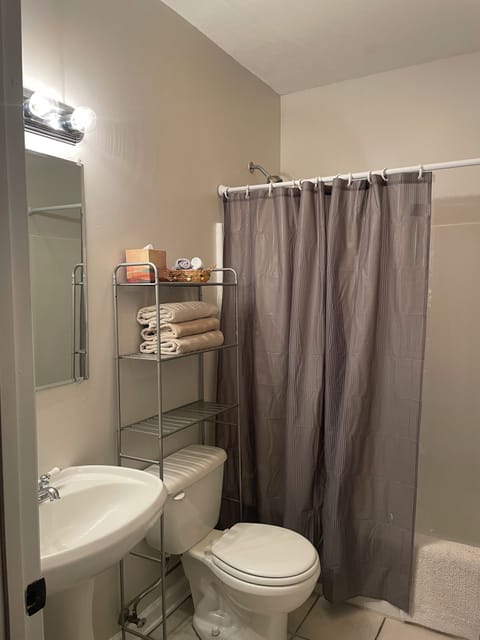 Front bathroom with tub/shower combo.