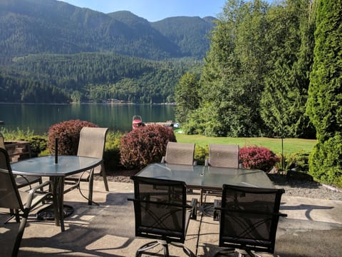Patio with firepit visible on left side; dock for swimming; lots of privacy.