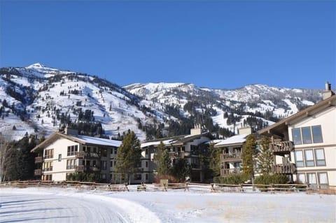 Condo at center right in front of ski mountain base.
