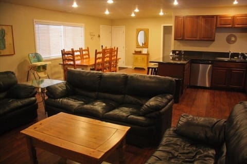 Living room, kitchen, dining room, entry way.