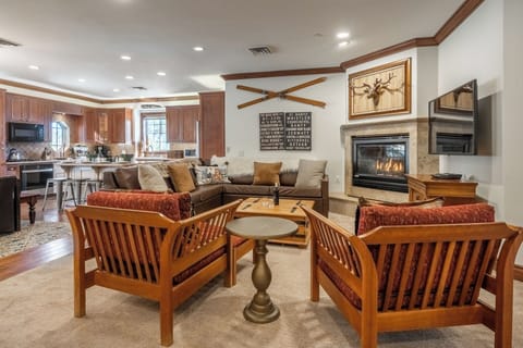Open living area with cozy seating, fireplace, and plenty of room to relax together.