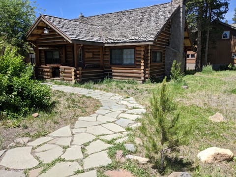 Original log cabin built in the early 40's. Parking in front of the house.