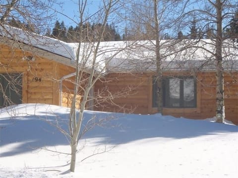 front of the house, lots of trees and plenty of  parking