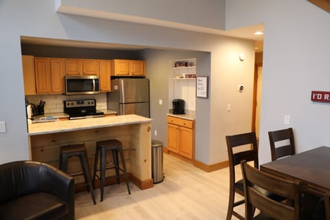 Renovated kitchen with beverage bar.