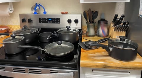 New kitchen electric range and pots and pans