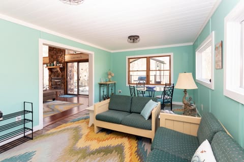 Second living room with additional table and seating. ideal game room for kids.