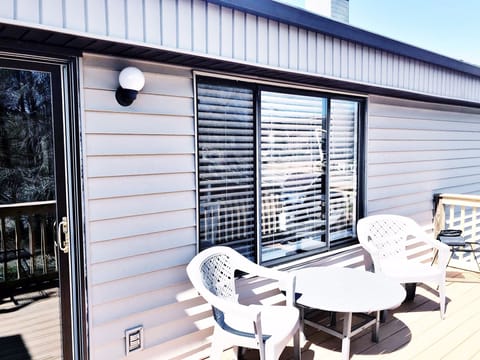 Deck with chairs, tables and propane grill