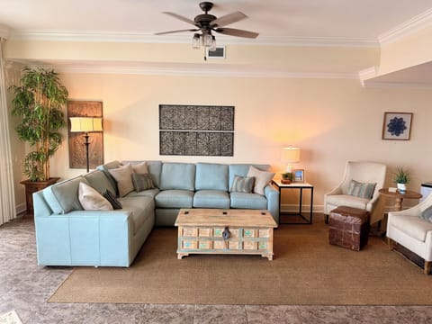 Large open living room.  High end leather sofa, open concept