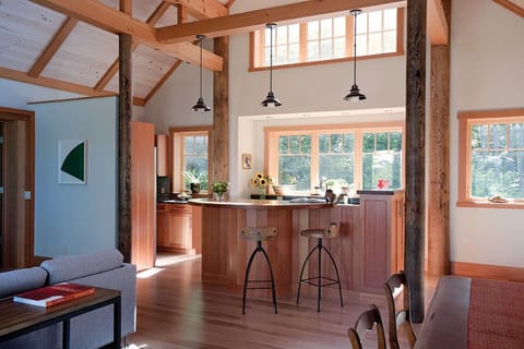 Looking at kitchen area - pantry left. Stools in front of the stove.