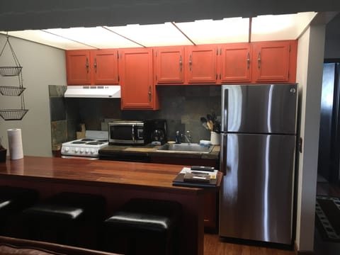 Kitchen with all necessary cooking utensils and cookware.