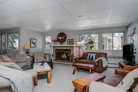 Spacious Living Room with sofa, two love seats and gas fireplace

