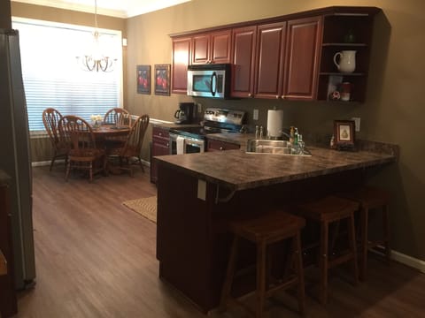 Large kitchen, stainless kitchen, with 12 cup drip coffee maker.