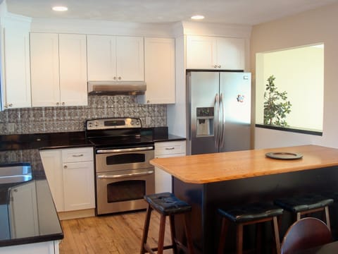 kitchen w/ breakfast bar that seats 4.  New pass through to enjoy the view!
