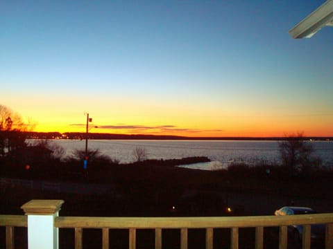 View of the sunset and beach across the street from the top deck.