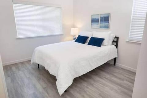 Bedroom 1 features a queen bed and serene olive orchard views, with a chance to spot wild turkeys.