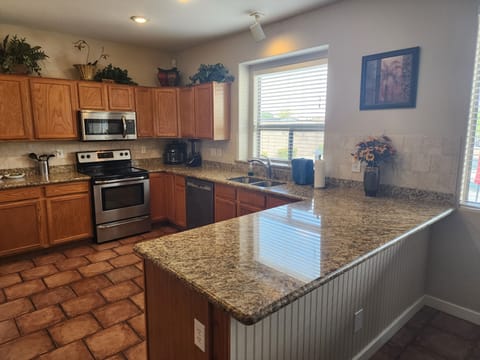 Kitchen with granite counter tops and stainless steel appliances