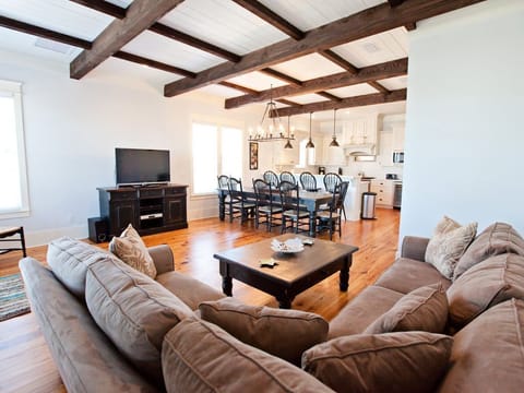 third floor seating area and kitchen in the background