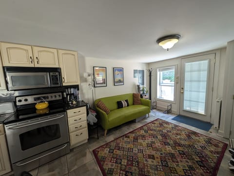 Living area with adjacent galley kitchen. 