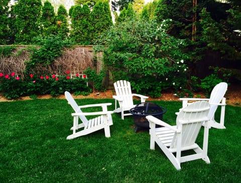 Backyard has a firepit for roasting s'mores and a gas grill.