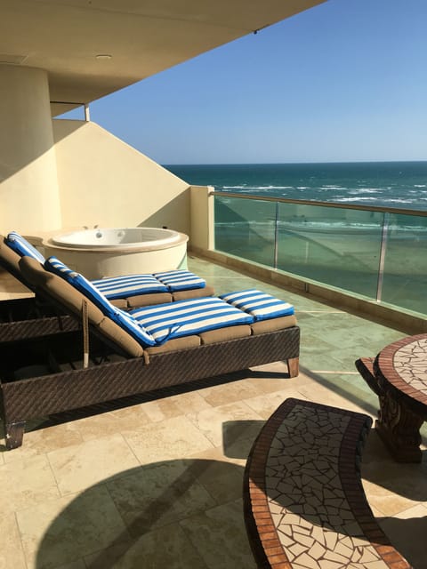 Spacious balcony w/ private hot tub, mosaic stone table, wet bar w/ grill