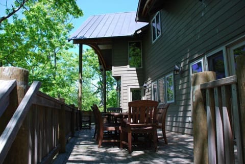 spacious deck, dining table seats 8, lounge chairs and grille