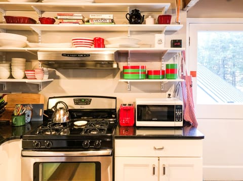 The kitchen is fully equipped with a gas range and everything you’ll need.