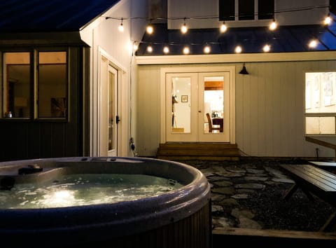 Enjoy the hot tub on the patio outside the living room